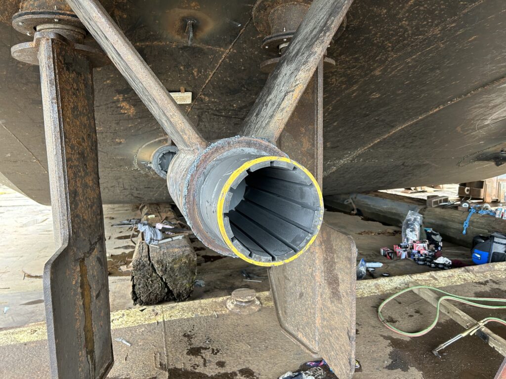 Bearing installed in housing with Devcon Plastic Steel Putty (A)